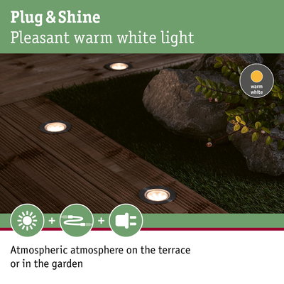 Warm white Plug & Shine LED recessed lights in wooden terrace creating atmospheric garden lighting