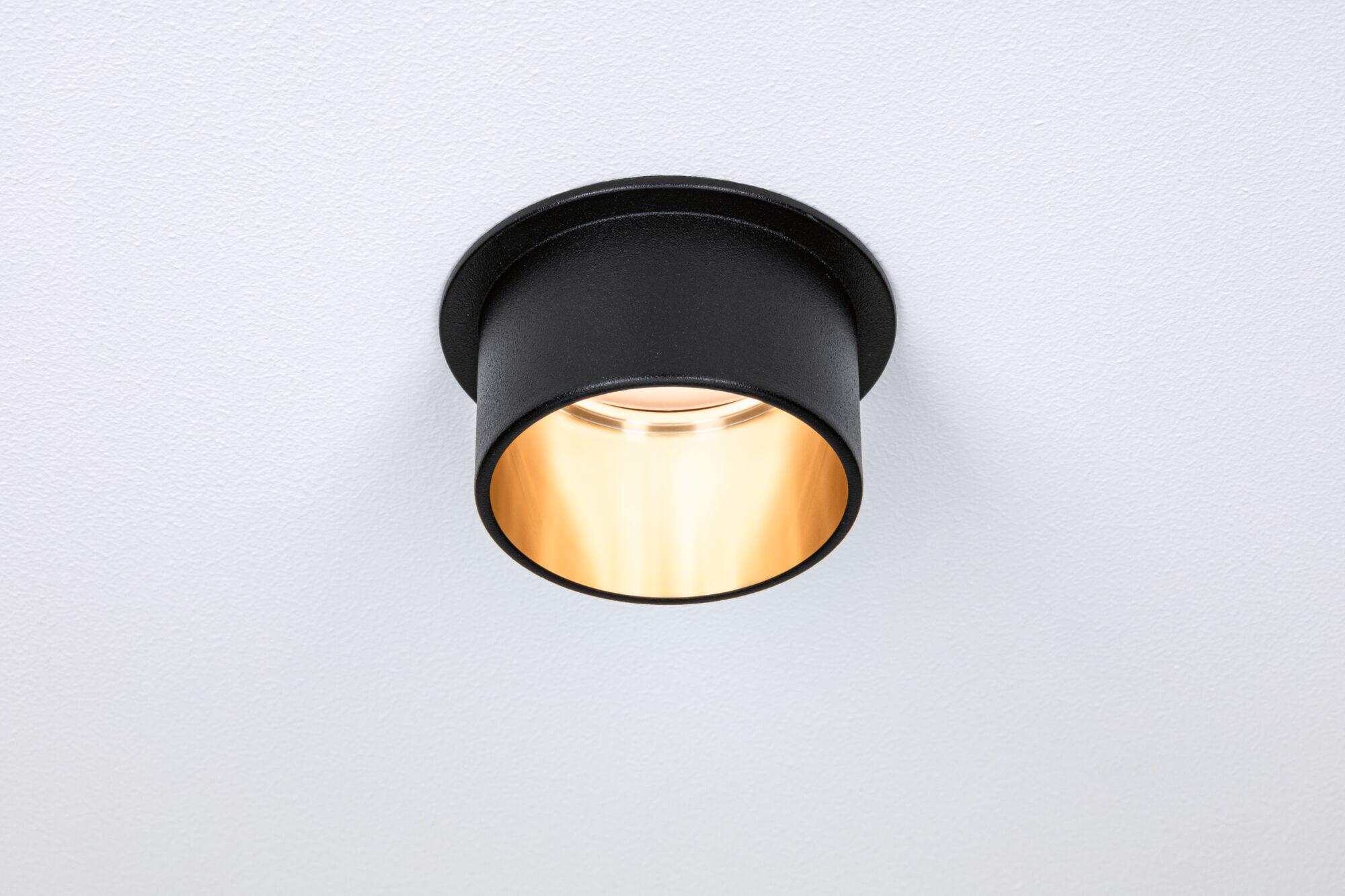 Black metal ceiling light with warm white illumination for modern interior lighting
