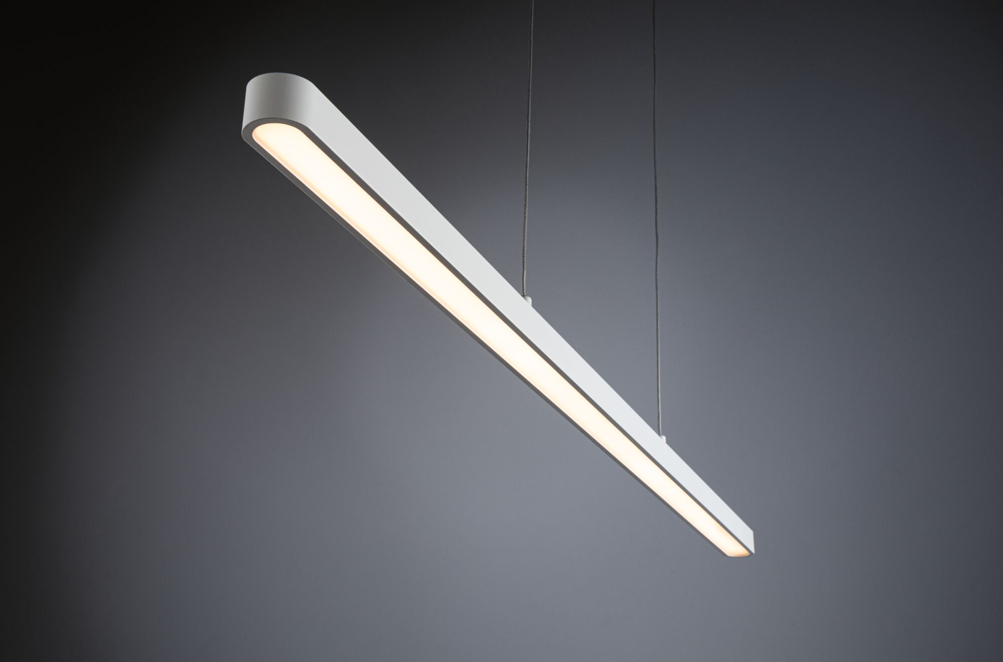 Modern white aluminum LED pendant light with warm white illumination for living spaces