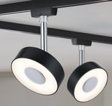 Modern black LED ceiling light with round design and chrome rod for living spaces.