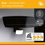Black solar outdoor light with IP65 rating and exchangeable battery, smart control via Alexa and Google Assistant.