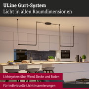 Modernes ULine Gurt-System in Schwarz über Kücheninsel für flexible Lichtgestaltung in Wohnräumen