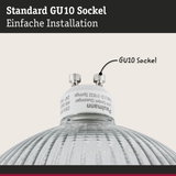 Nahaufnahme einer GU10 Fassung mit weißem Sockel und geriffeltem Glas für LED-Lampen