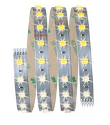 Flexible LED strip with warm white LEDs on silver circuit board for decorative lighting use
