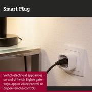 White smart plug in socket with black cable for Zigbee control of electrical appliances
