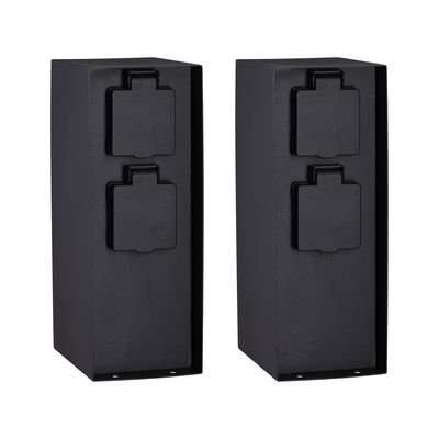 Two black metal outdoor sockets with protective covers for weatherproof power supply outdoors