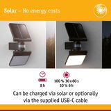 Black solar wall light with motion sensor shown day and night, energy-saving outdoor lighting with USB-C charging option