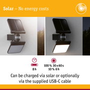 Black solar outdoor wall light with motion sensor shown in day and night views, energy-saving lighting