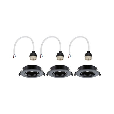 Three black recessed spotlights with white cable connectors for LED lighting installation