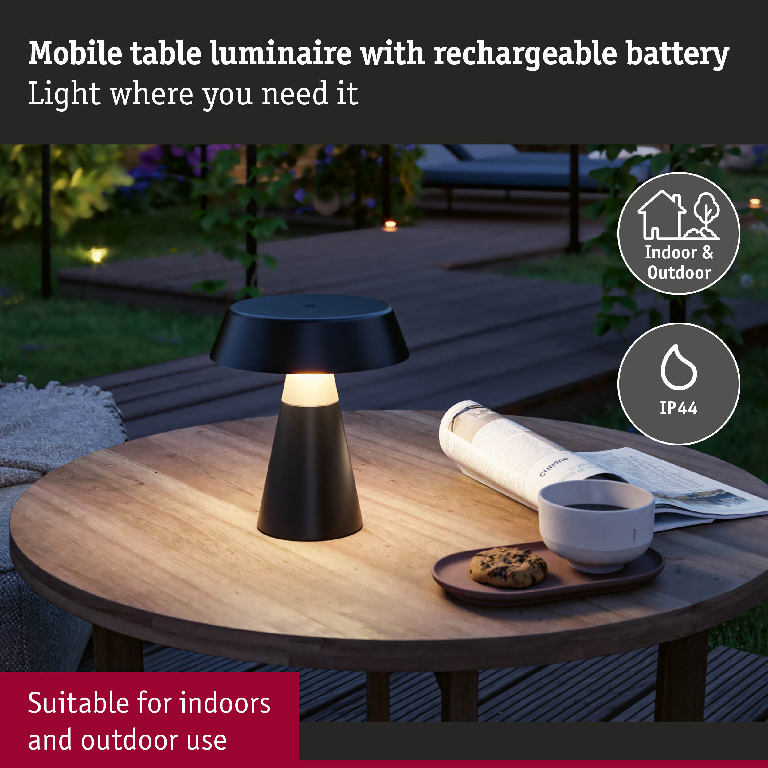 Mobile black table lamp with rechargeable battery on wooden table, suitable for indoor and outdoor use