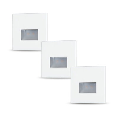 Three white square LED recessed wall lights with diffused light for modern indoor lighting
