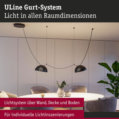Modernes ULine Gurt-System mit schwarzen Hängeleuchten über rundem Tisch für individuelle Lichtgestaltung