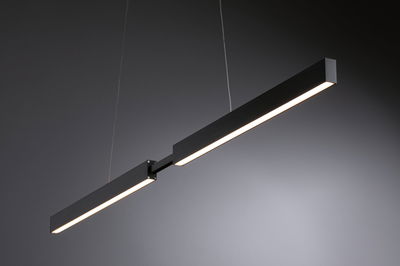 Modern black metal LED pendant light with warm white illumination for stylish indoor lighting