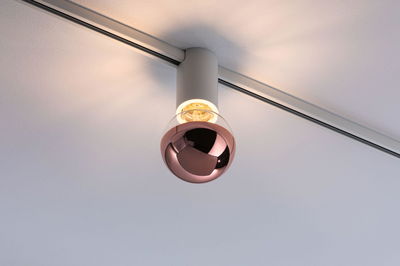 Modern ceiling spotlight with white housing and copper glass globe for stylish room lighting