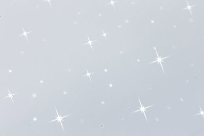 Weiße Oberfläche mit funkelnden Lichtreflexen und glitzernden Sterneneffekten für Dekoration und Beleuchtung