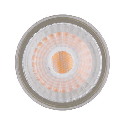 Close-up of LED spotlight with clear glass and warm white light for indoor lighting use