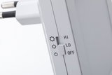 White plastic switch with HI, LO, OFF settings for electronic device control in close-up