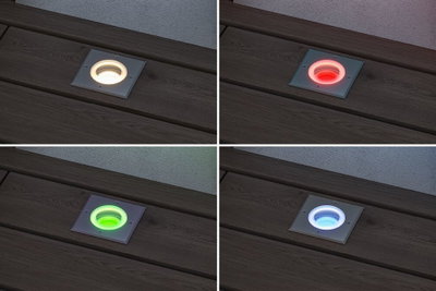 Quatre spots LED encastrés au sol carrés blancs avec couleurs changeantes rouge, vert, bleu et blanc chaud.
