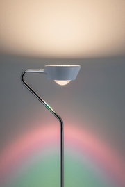 Modern floor lamp with white shade and chrome metal frame, LED light featuring colour change effect