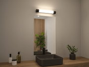 Schwarzes quadratisches Waschbecken aus Keramik mit schwarzem Wasserhahn und LED-Wandleuchte im Bad