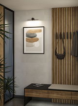 Modern hallway with wooden bench, wall panels and black LED picture light for home lighting