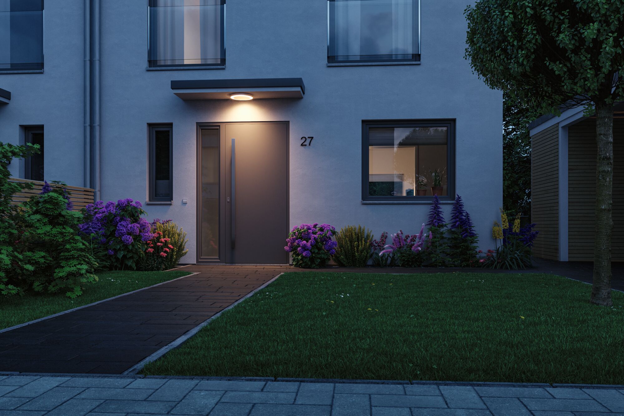 Modern house facade with grey front door and round outdoor light for atmospheric garden lighting