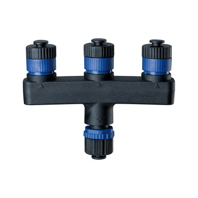 Black plastic connector with blue screw caps for electrical wiring and connections