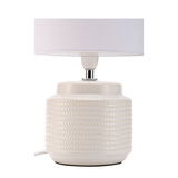 Lampe de table en céramique blanche avec motif texturé et abat-jour en tissu blanc pour éclairage intérieur