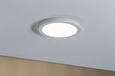 Round white metal LED ceiling light with diffused cover for modern ambient lighting