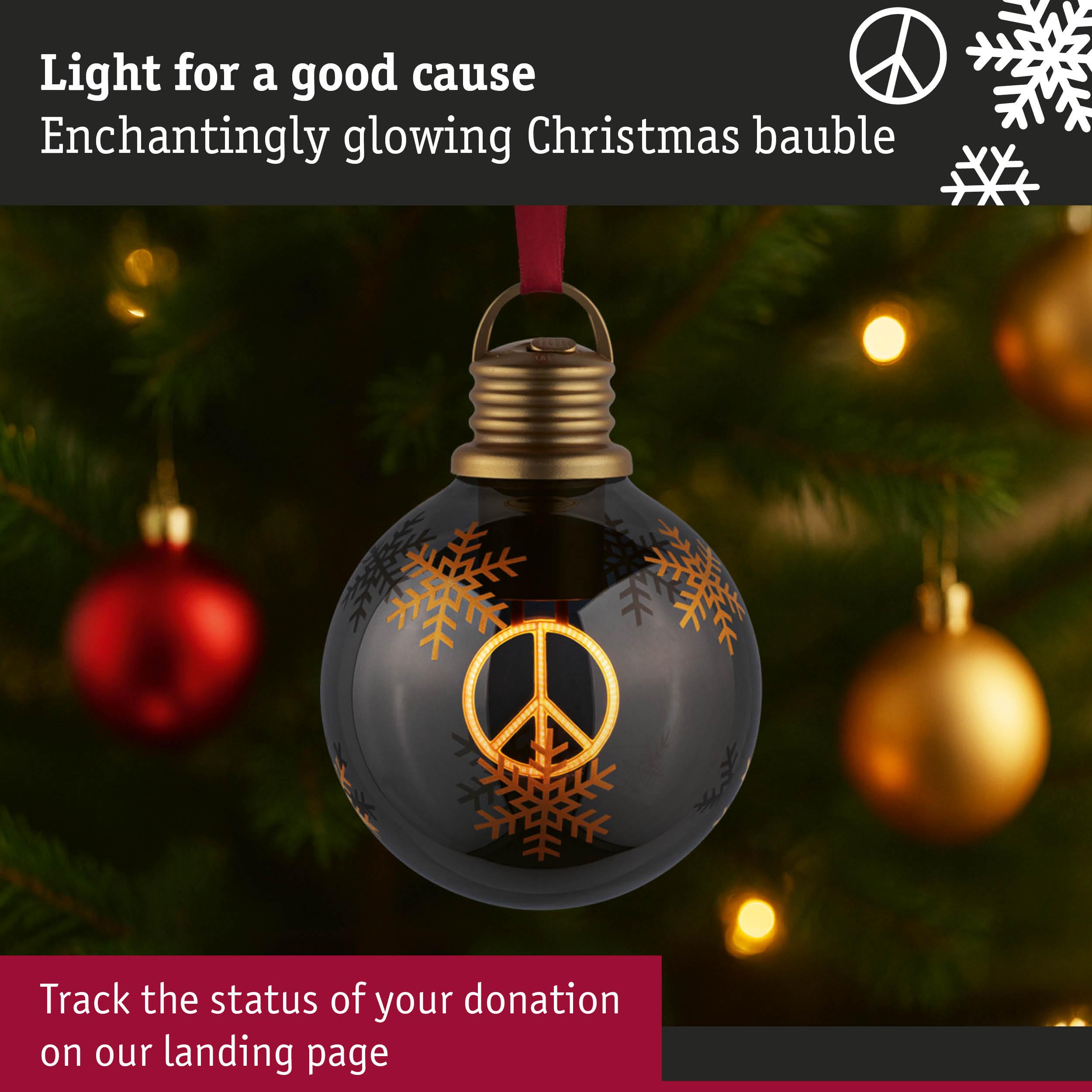Black Christmas bauble with glowing peace symbol and gold snowflakes for festive decoration