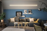 Modern living room with grey sofa, blue wall and minimalist LED ceiling light for ambient home lighting