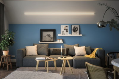 Modern living room with grey sofa, blue wall and minimalist LED ceiling light for ambient home lighting