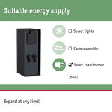 Black metal transformer with protective cover and connection terminals for lighting systems
