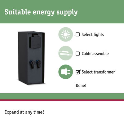 Black metal transformer with protective cover and connection terminals for lighting systems
