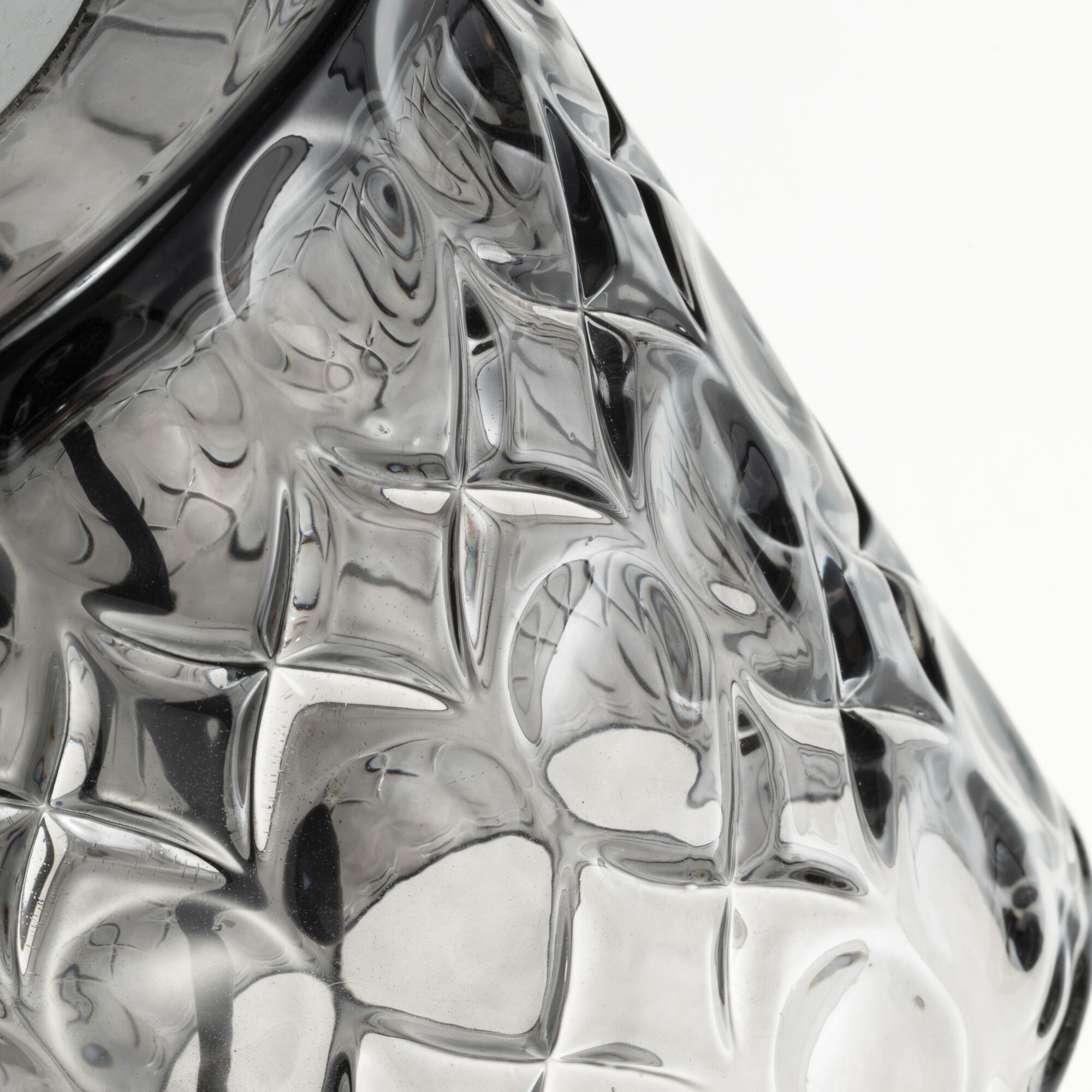 Close-up of transparent textured glass lampshade with geometric pattern for LED lighting fixtures