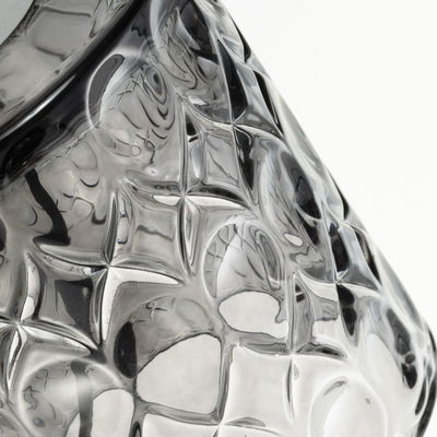 Close-up of transparent textured glass lampshade with geometric pattern for LED lighting fixtures