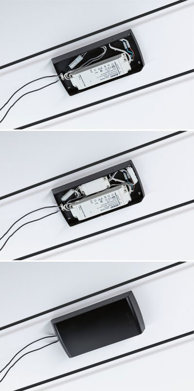 Black cover for LED driver showing white electronic ballast and wiring connections on ceiling