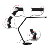 Black metal LED desk lamp with adjustable joints for flexible office lighting and modern workspace design.