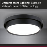 Round black LED ceiling light providing uniform room lighting with advanced LED technology