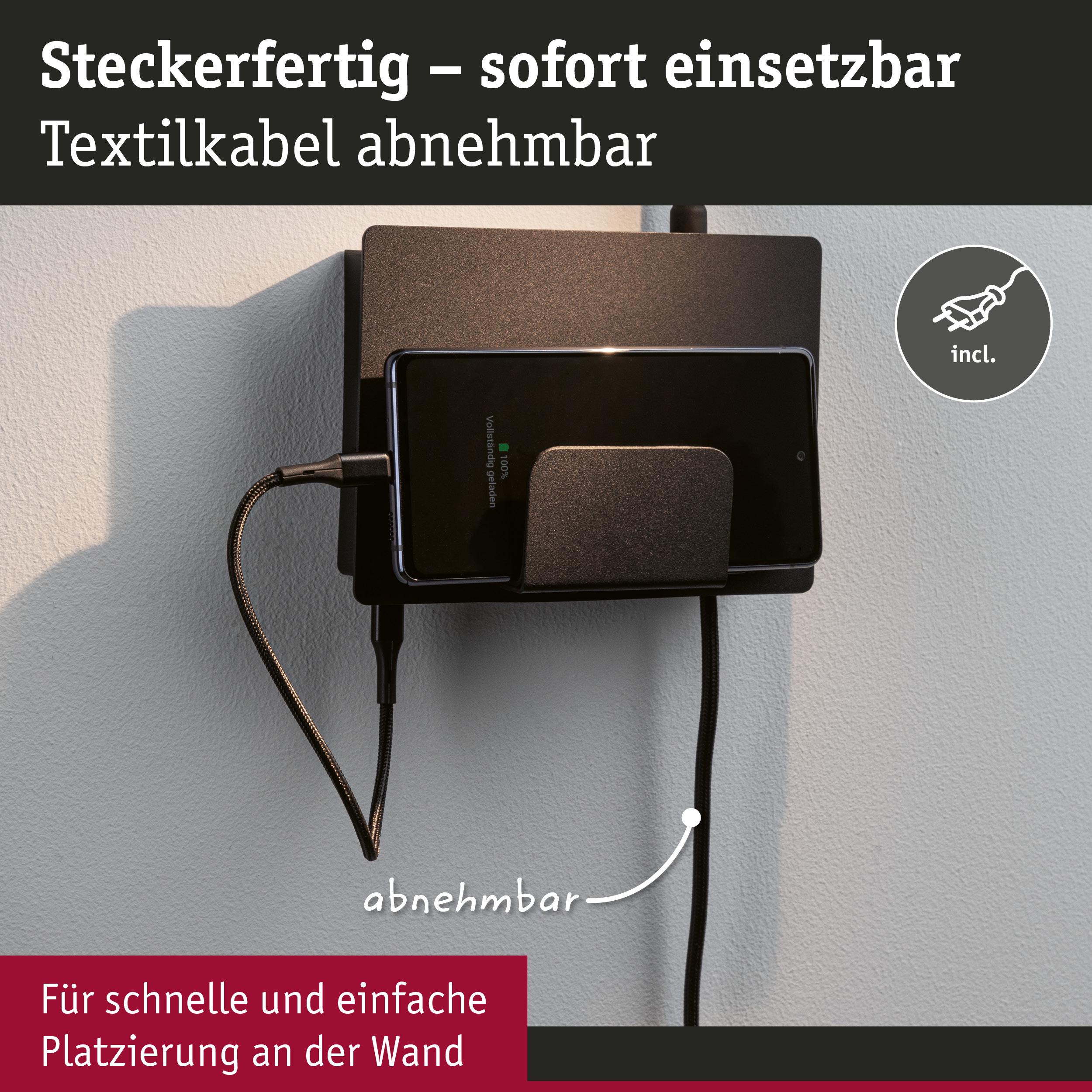 Schwarze Wandhalterung mit abnehmbarem Textilkabel und Smartphone-Ladestation für einfache Platzierung.