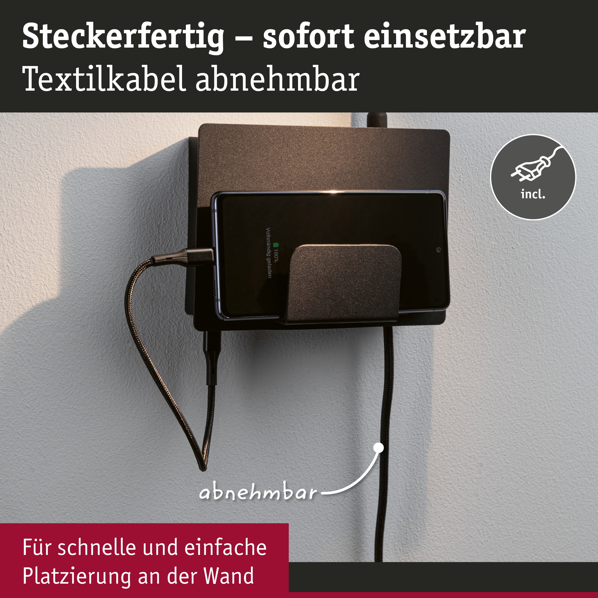 Schwarze Wandhalterung mit abnehmbarem Textilkabel und Smartphone-Ladestation für einfache Platzierung