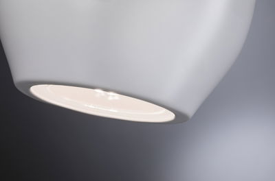 Modern white metal LED ceiling spotlight with warm white light for living spaces