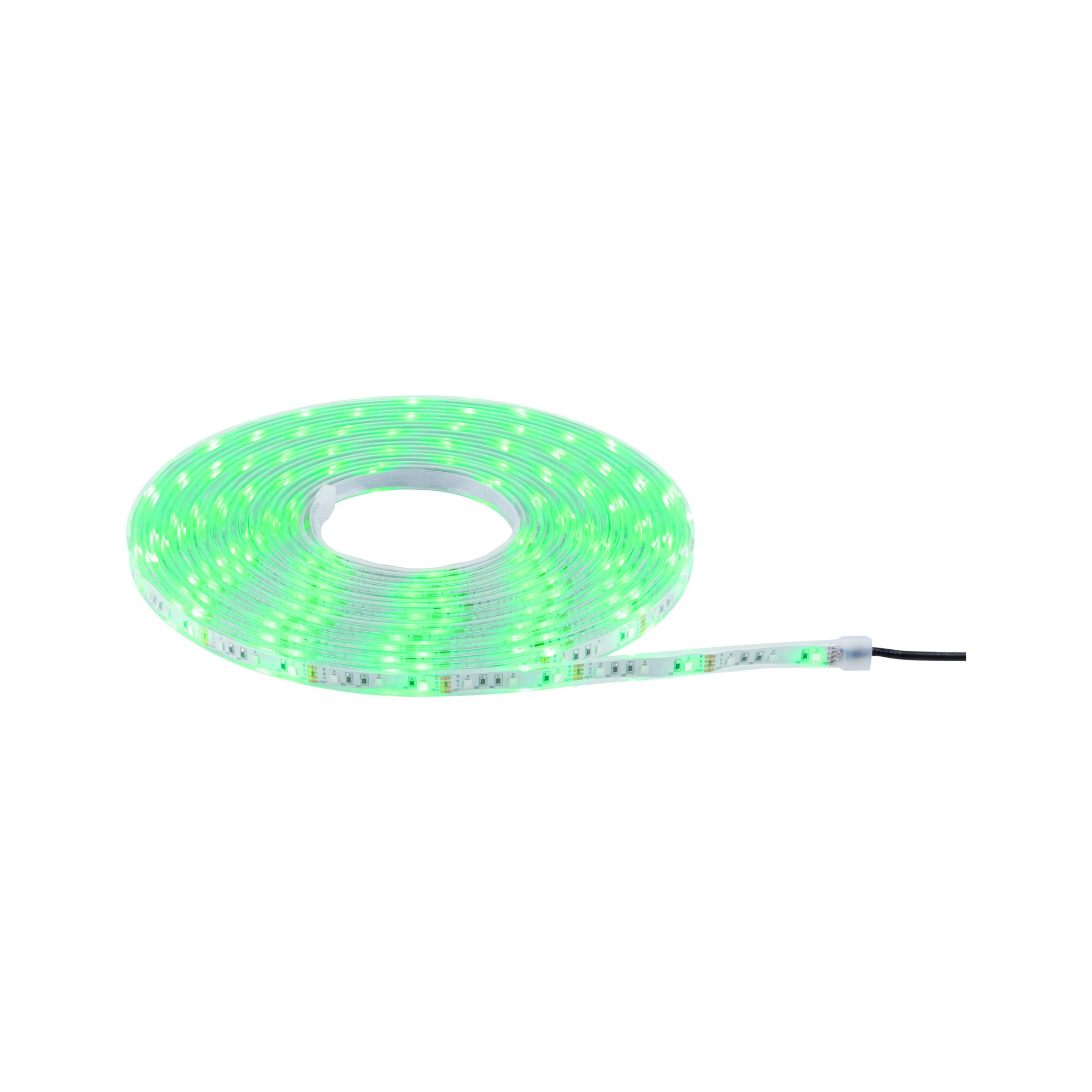 Green glowing LED strip light on roll with flexible plastic material for decorative lighting use.