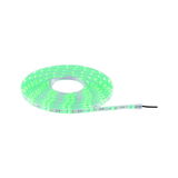 Green glowing LED strip light on roll with flexible plastic material for decorative lighting use.