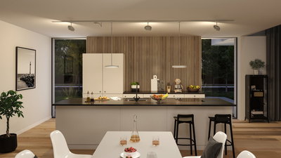 Cuisine moderne avec îlot blanc, mur en bois et éclairage LED économique au plafond Paulmann.