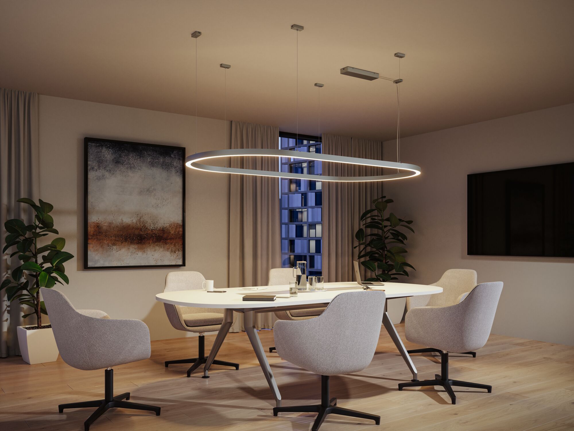 Moderne ronde witte LED-hanglamp met warm wit licht boven vergadertafel op kantoor.