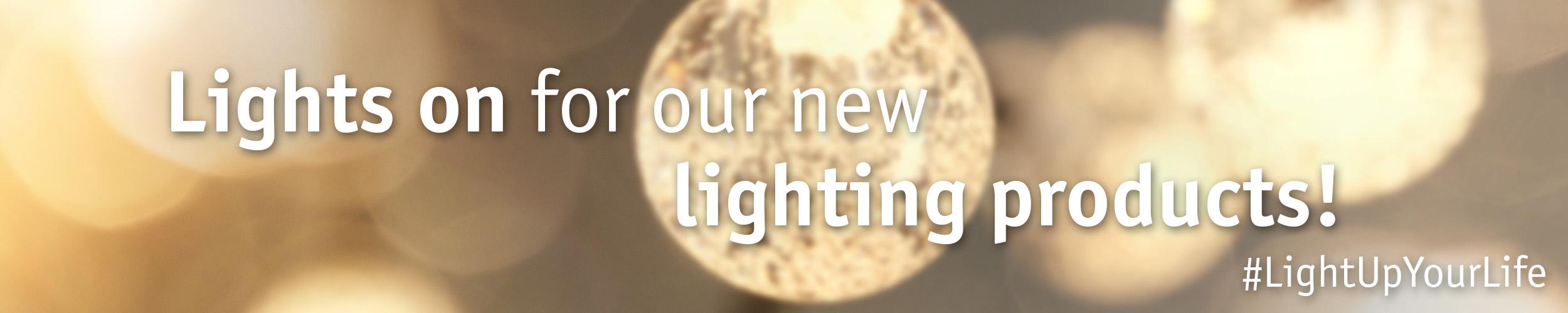 Banner with blurred warm white lights and text promoting new lighting products online.