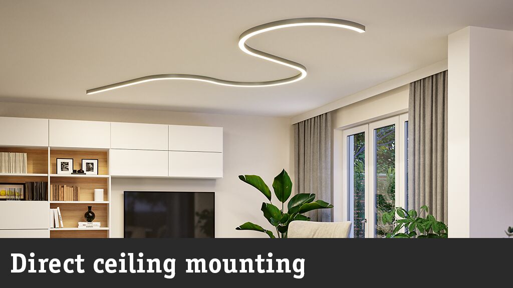 Modern living room with curved white LED ceiling light providing stylish ambient lighting