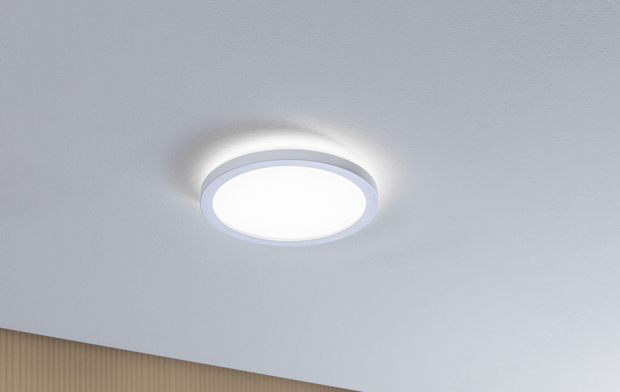 Round white LED ceiling light with warm white glow for modern rooms and energy-efficient lighting
