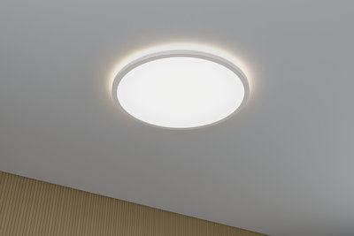 Round white LED ceiling light with indirect glow and modern design for living spaces.